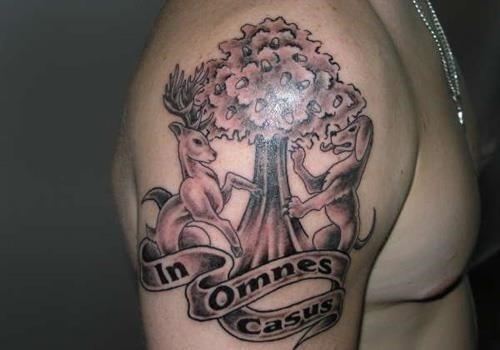 Grey ink family tree tattoo on shoulder