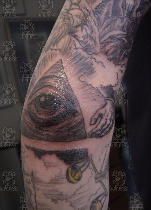 Grey ink triangle elbow tattoo