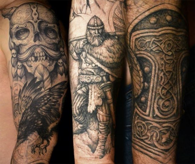 Grey ink viking tattoo on left sleeve for men