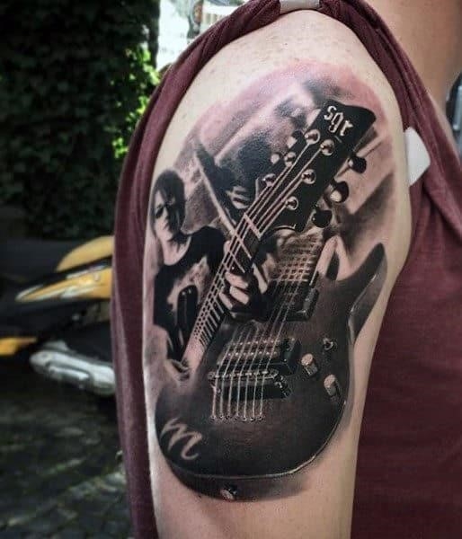 Guitar and music note mens tattoos on arm