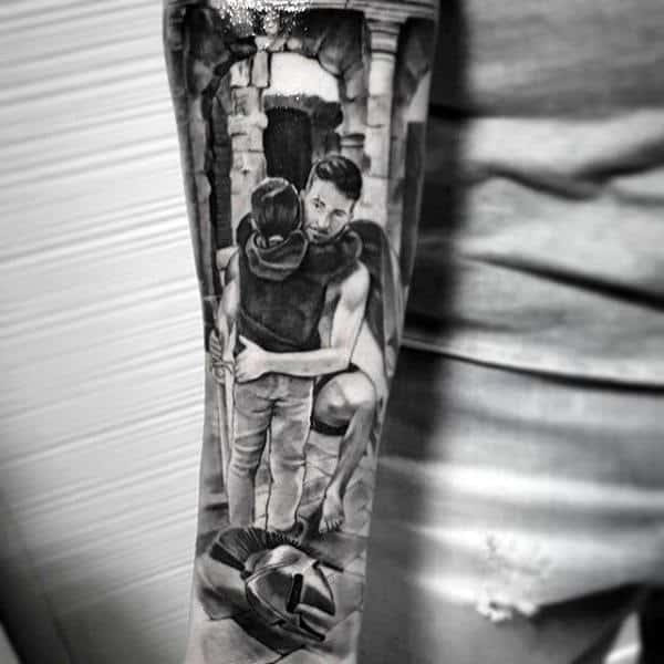 Guy with doting dad and son family tattoo on forearms