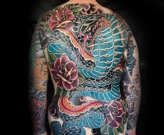 Guy with full back blue japanese snake tattoo design