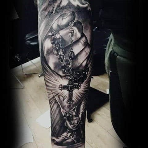 Guys forearms cross rosary religious tattoo