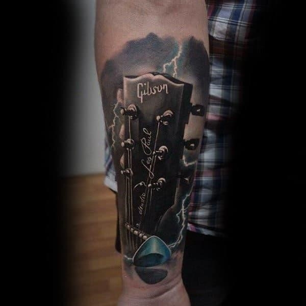 Guys forearms sick musical instrument tattoo