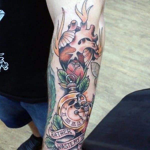 Guys heart tattoo neo traditional style with rose and compass on forearm