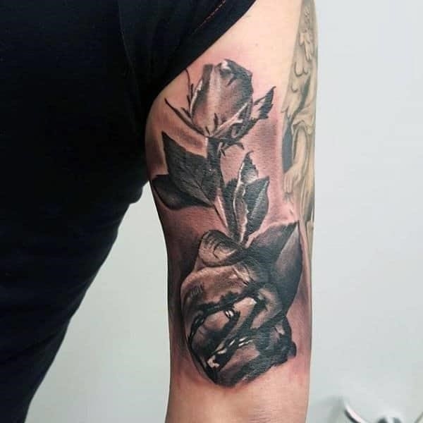 Guys triceps hand with rose tattoo