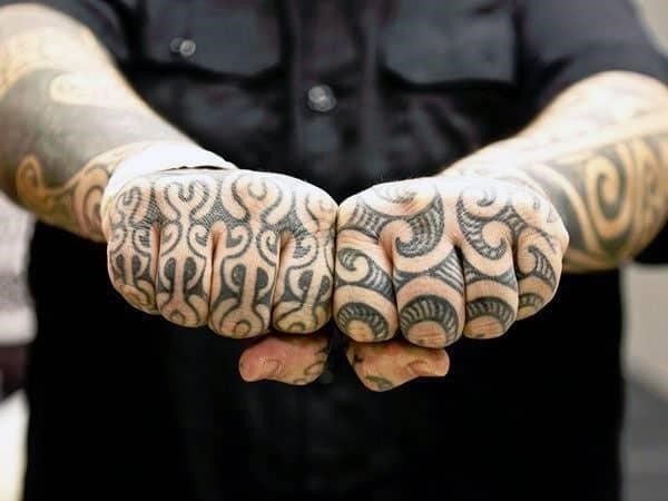 Hand and tribal knuckle tattoos for men