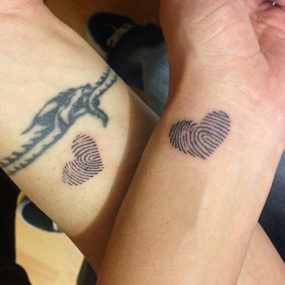 His and hers matching thumbprint tattoos