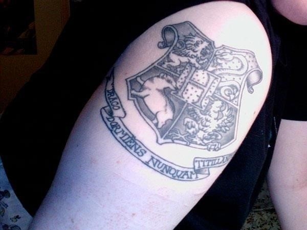 Hogwarts crest and motto tattoo