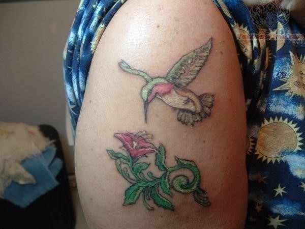 Hummingbird tattoo on bicep