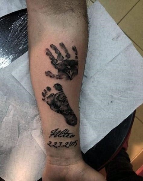 Inner forearm male handprint and footprint tattoos