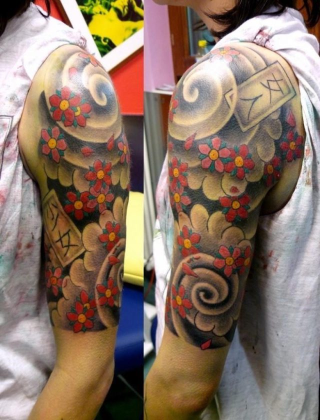 Japanese flowers half sleeve tattoo