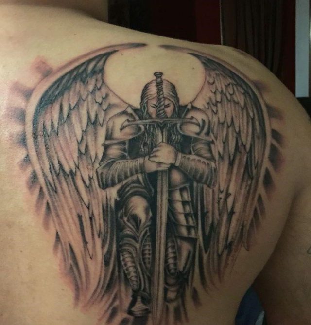 Knightly guardian angel tattoo for men