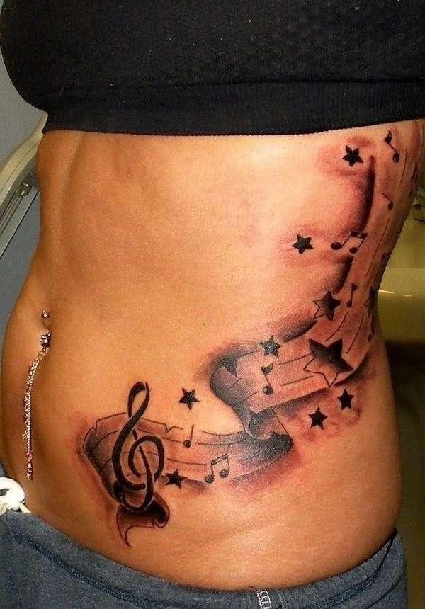 Left rib side stars and music tattoo