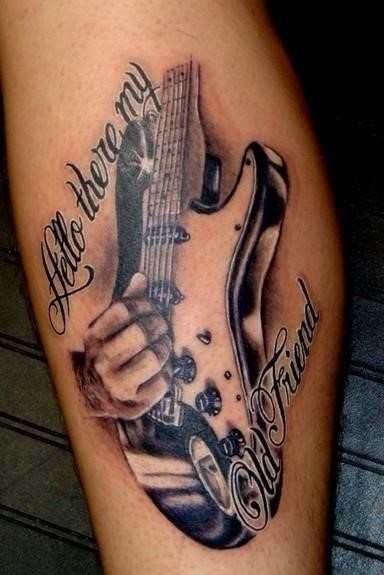 Lettering and guitar tattoo