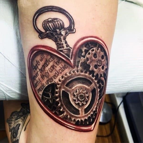 Lovely heart with touching message and metallic gears tattoo male triceps