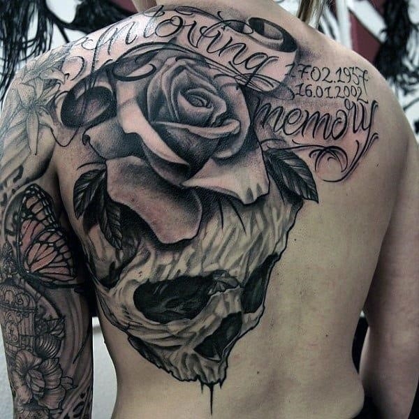 Male chest cool rose and skull tattoo with wordings
