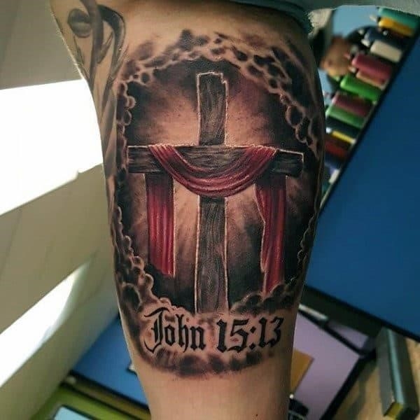 Male forearms great cross religious tattoo