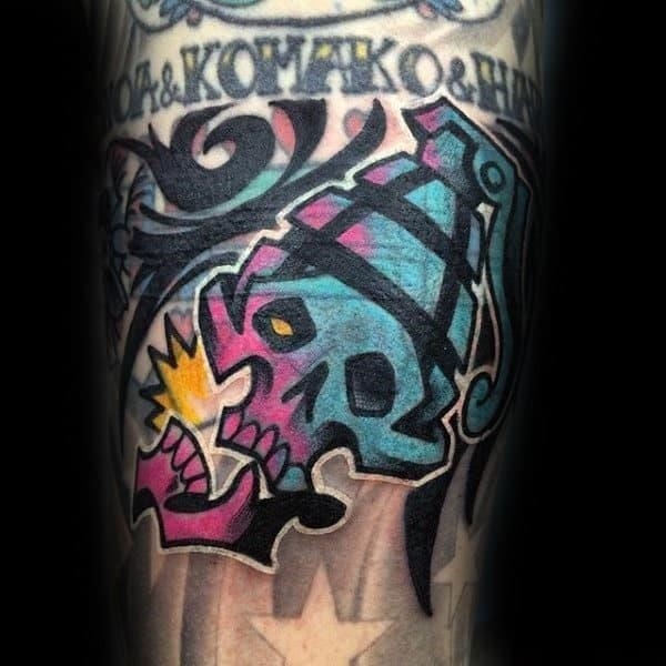 Male forearms pink blue sick skull tattoo