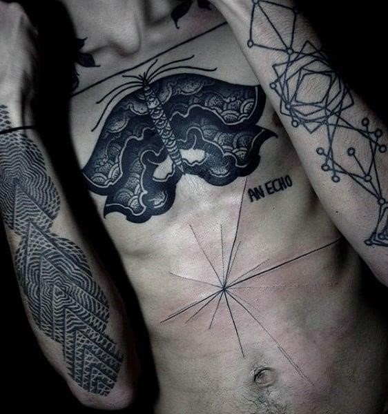 Male with abstract black thin line work stomach tattoo design and chest ink
