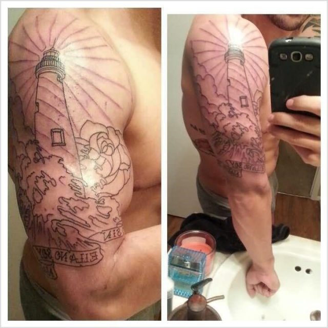 Man right bicep lighthouse tattoo