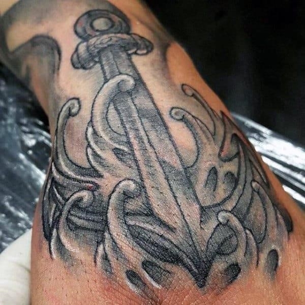 Man with anchor tattoo