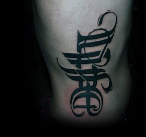 Man with death life tattoo on rib cage side