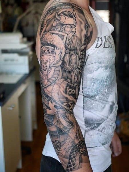 Man with viking sword tattoo full sleeve