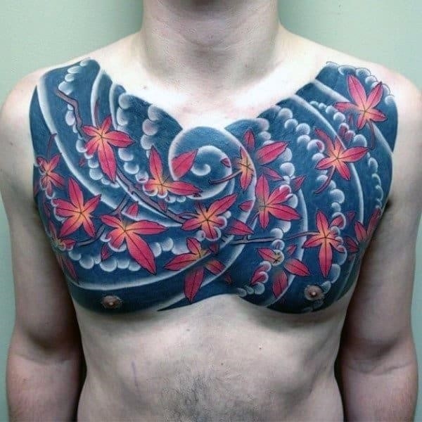 Maple leaves blowing in the wind japanese mens upper chest tattoo