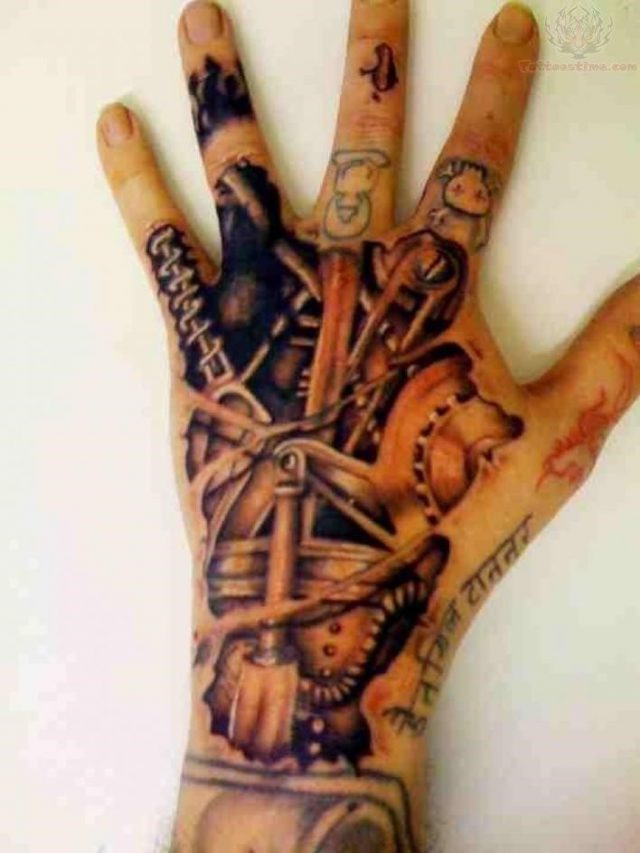 Mechanical back hand tattoo