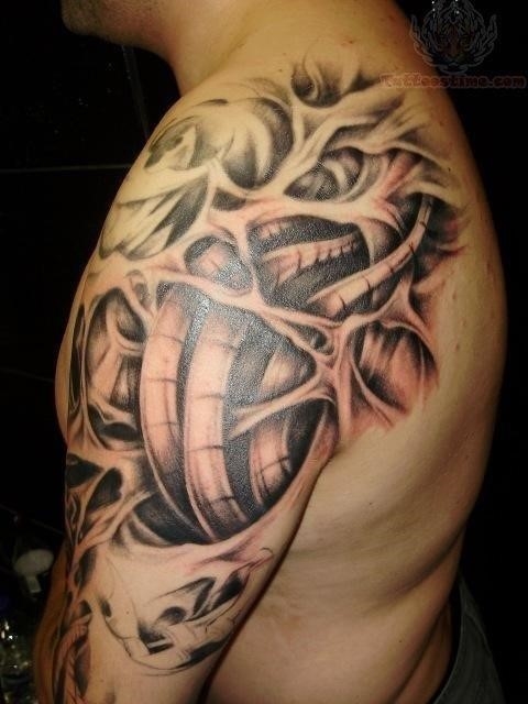 Grey Ink Bio Mechanical Tattoo On Shoulder