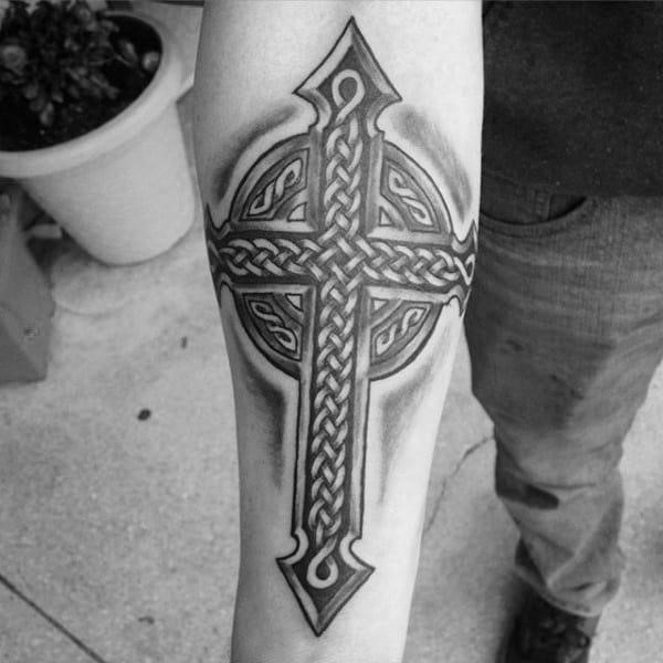 Mens black ink shaded celtic cross inner forearm tattoos