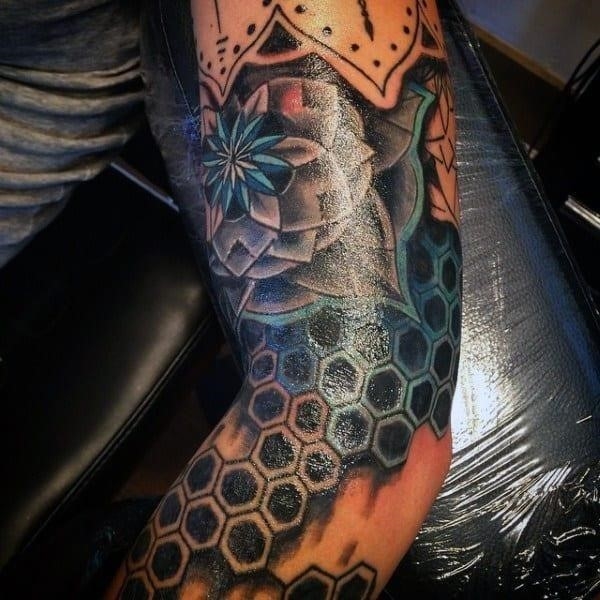 Mens flower elbow tattoo