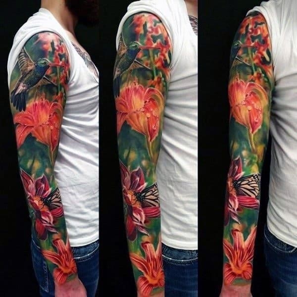 Mens full flower themed sleeve with hummingbirds tattoo