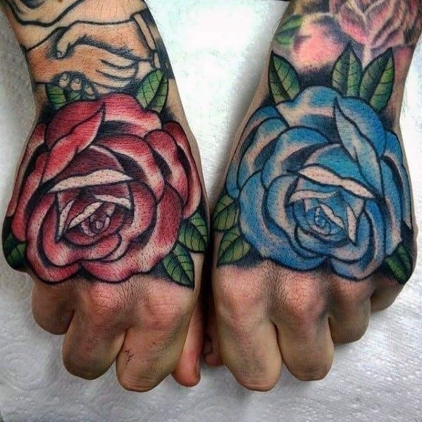 Mens hand blue and red rose flowers traditional hand tattoos