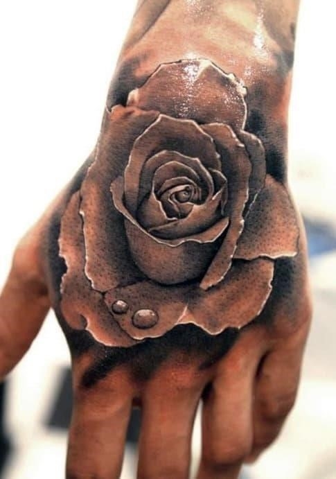Mens rose tattoo on hand