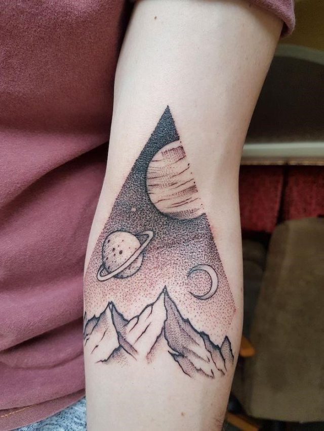 Mountain landscape inside a triangle planets moon above them space tattoo ideas forearm tattoo