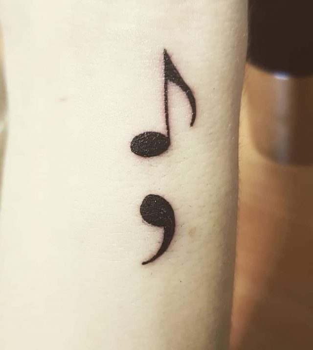 Music notes black ink semicolon tattoo
