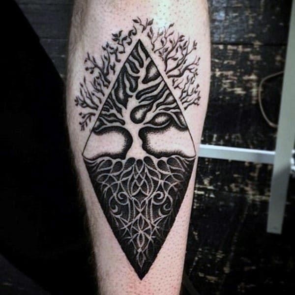 Negative space opposite mens tree of life inner forearm tattoos