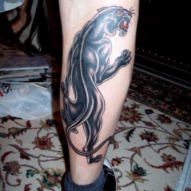 Panther leg tattoo for men