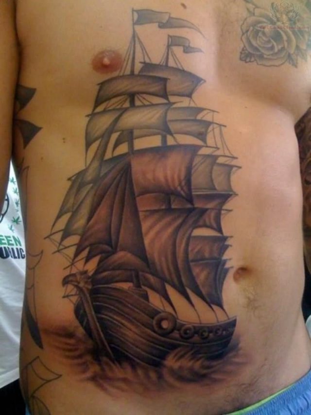 Pirate ship tattoo on belly