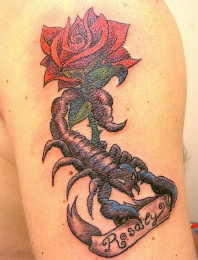 Red rose and scorpio tattoo on left half sleeve