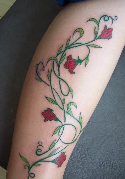 Red vine flowers tattoo