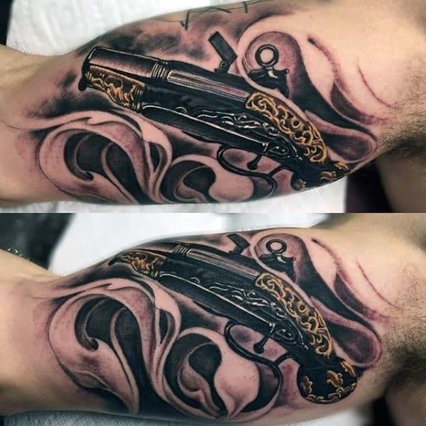 Revolver with golden carvings sick tattoo male arms