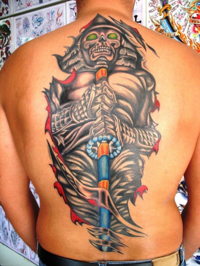 Ripped skin japanese tattoo on man back