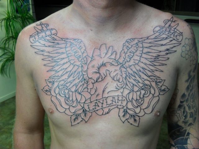 Rose flowers and angel wings chest tattoo