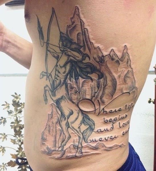 Sagittarius archer mens rib cage side tattoo