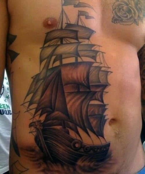 Sailing ship lower stomach tattoo designs for men