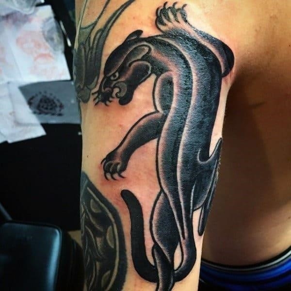 Shiny black dragon tattoo male triceps