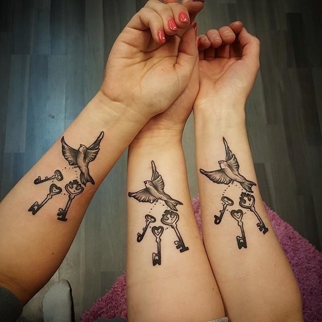 Sister matching tattoos